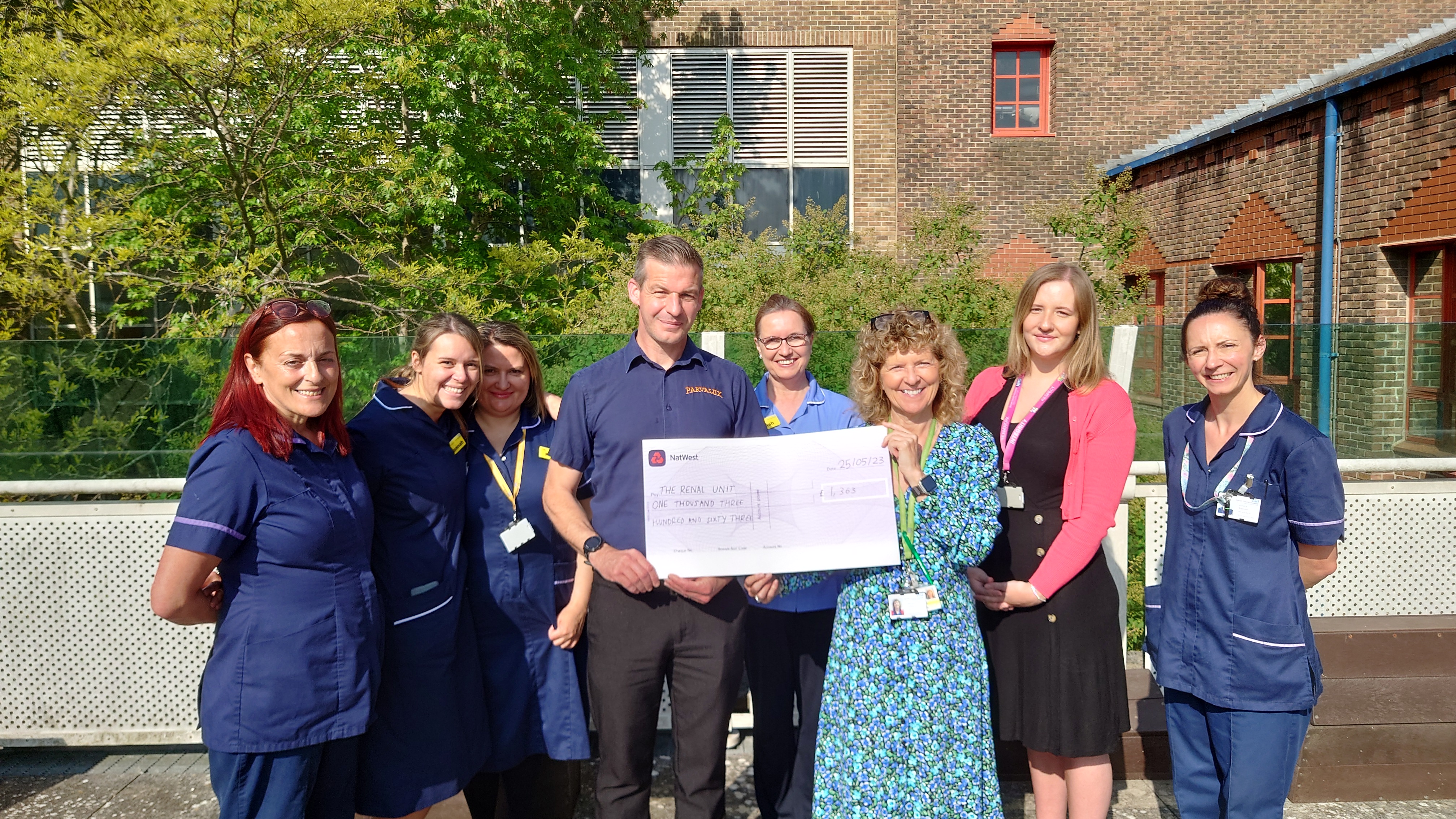 James presenting a cheque for £1,363 to the Renal Unit team at Dorchester County Hospital, May 2023