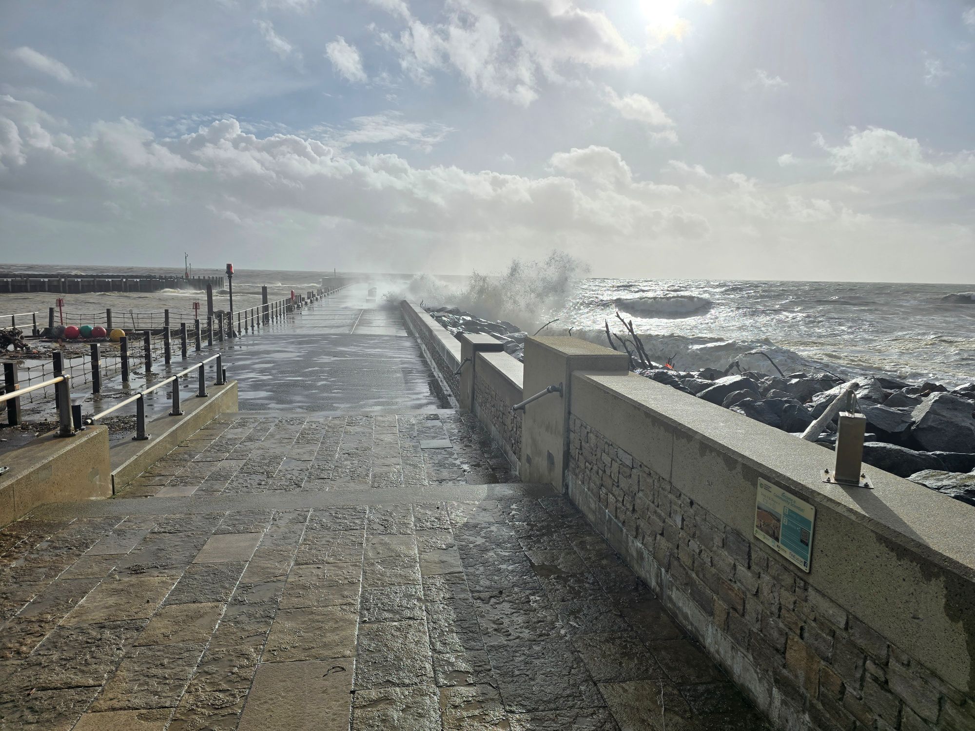 Bridport harbour arm in a storm — the coast path on a proper day