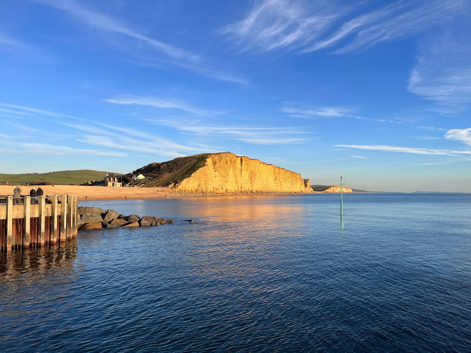 West Bay cliffs and empty beach, Dorset — the back garden
